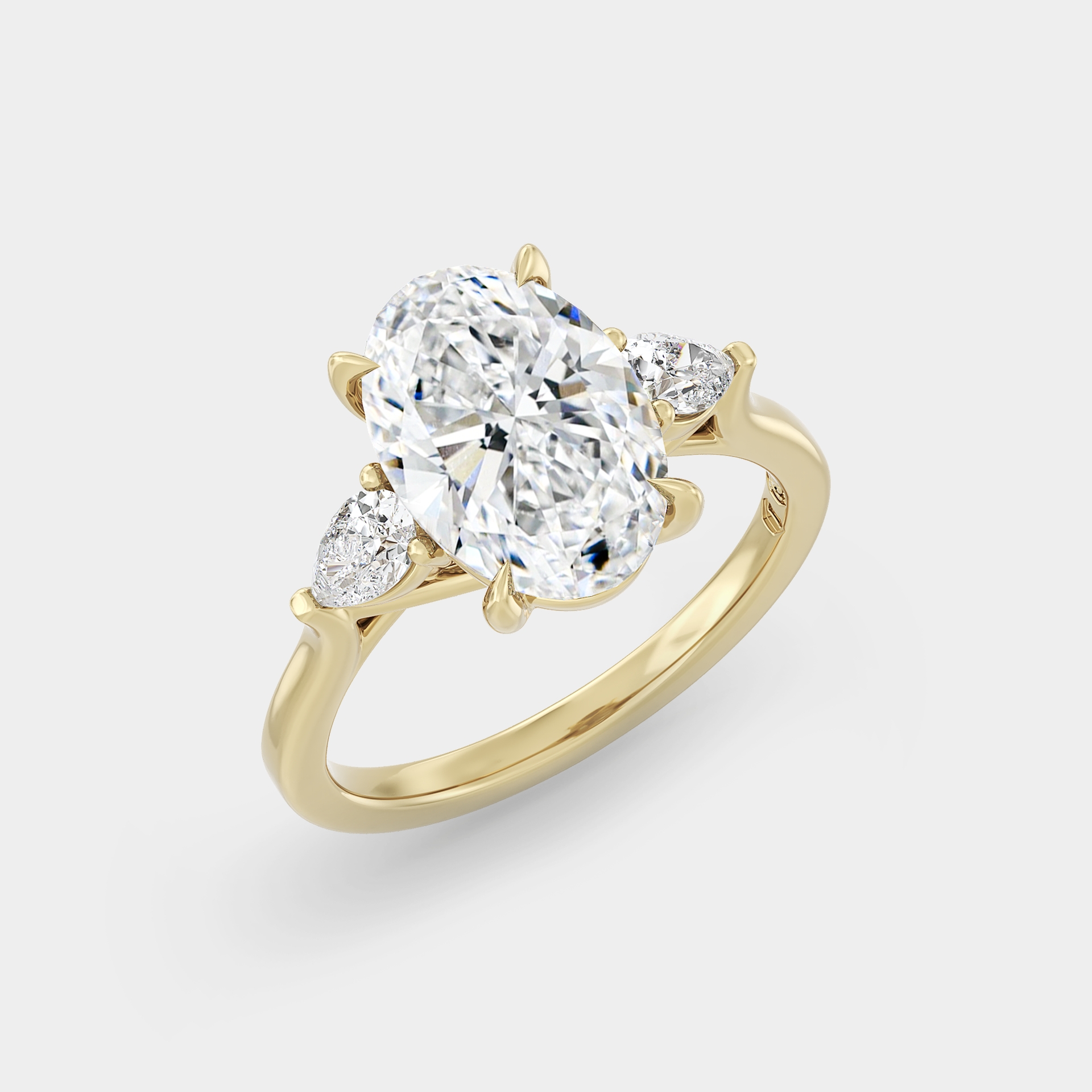 Trilogy of Oval Sapphire & Pear, Trellis Setting