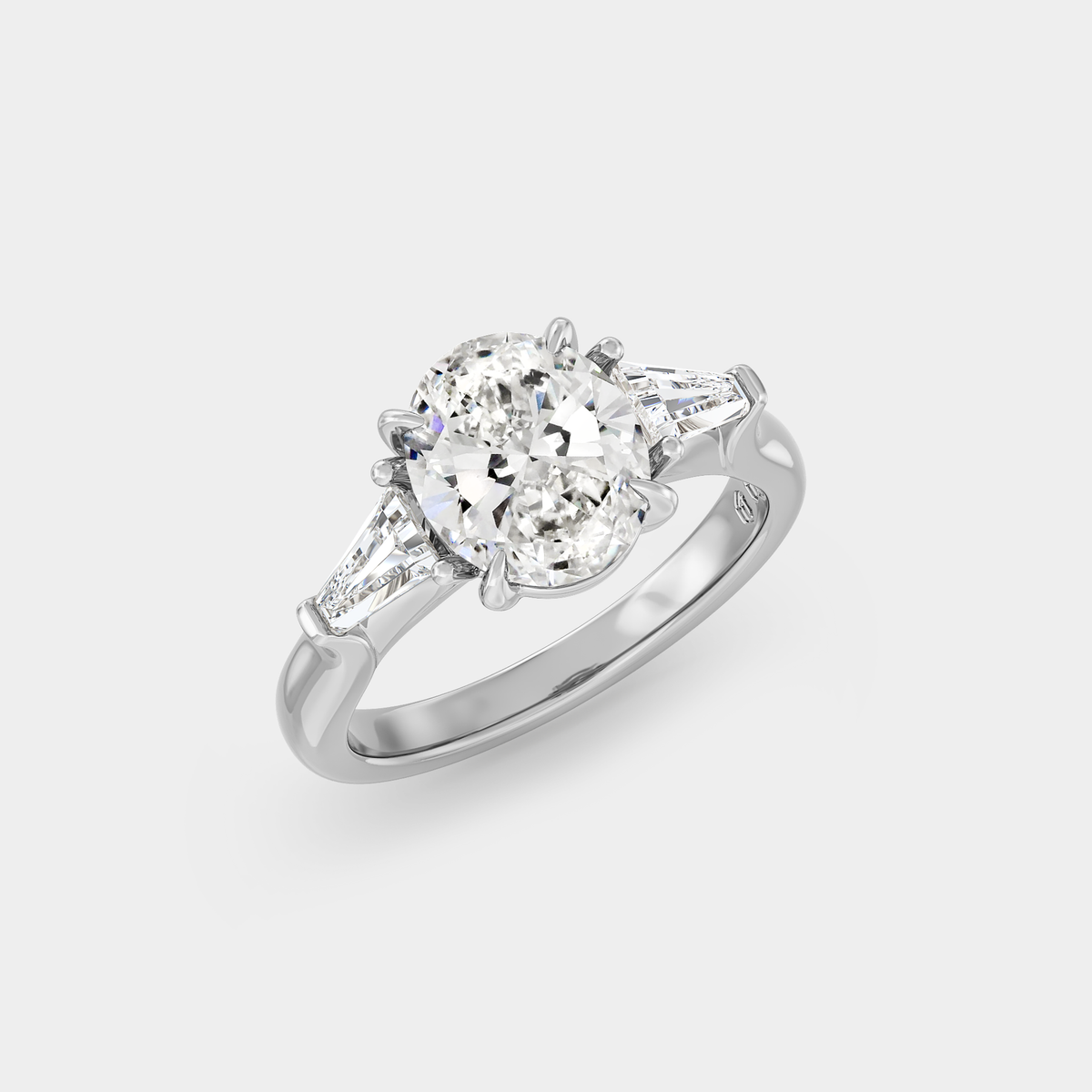 Three Stone of Oval Sapphire & Tapered Baguette