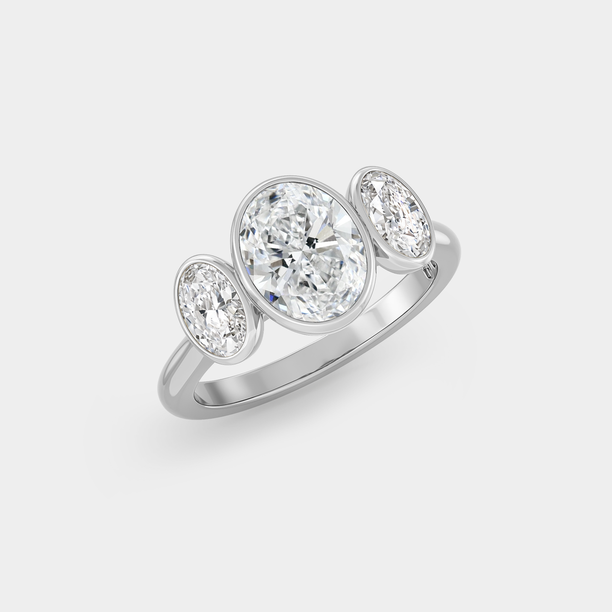 Trilogy of Lab Grown Oval Diamond Bezel Set