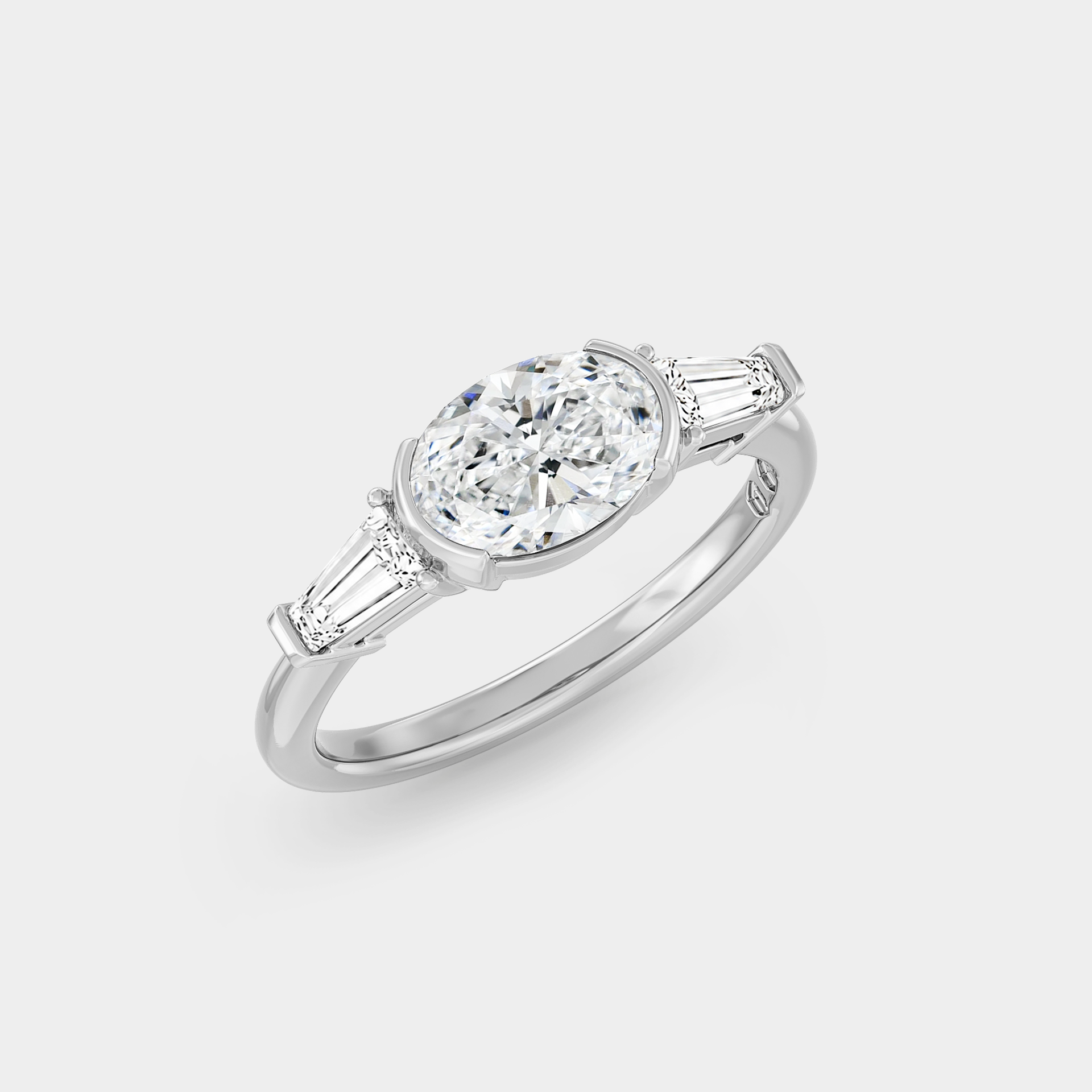 Three Stone of Oval Sapphire & Tapered Baguettes