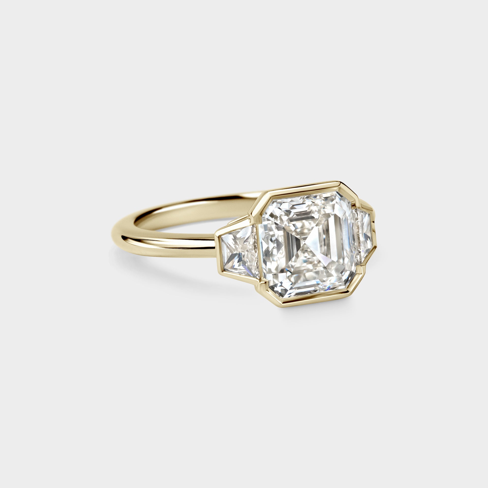 Three Stone of Asscher & Trapezoid in Continuous Bezel