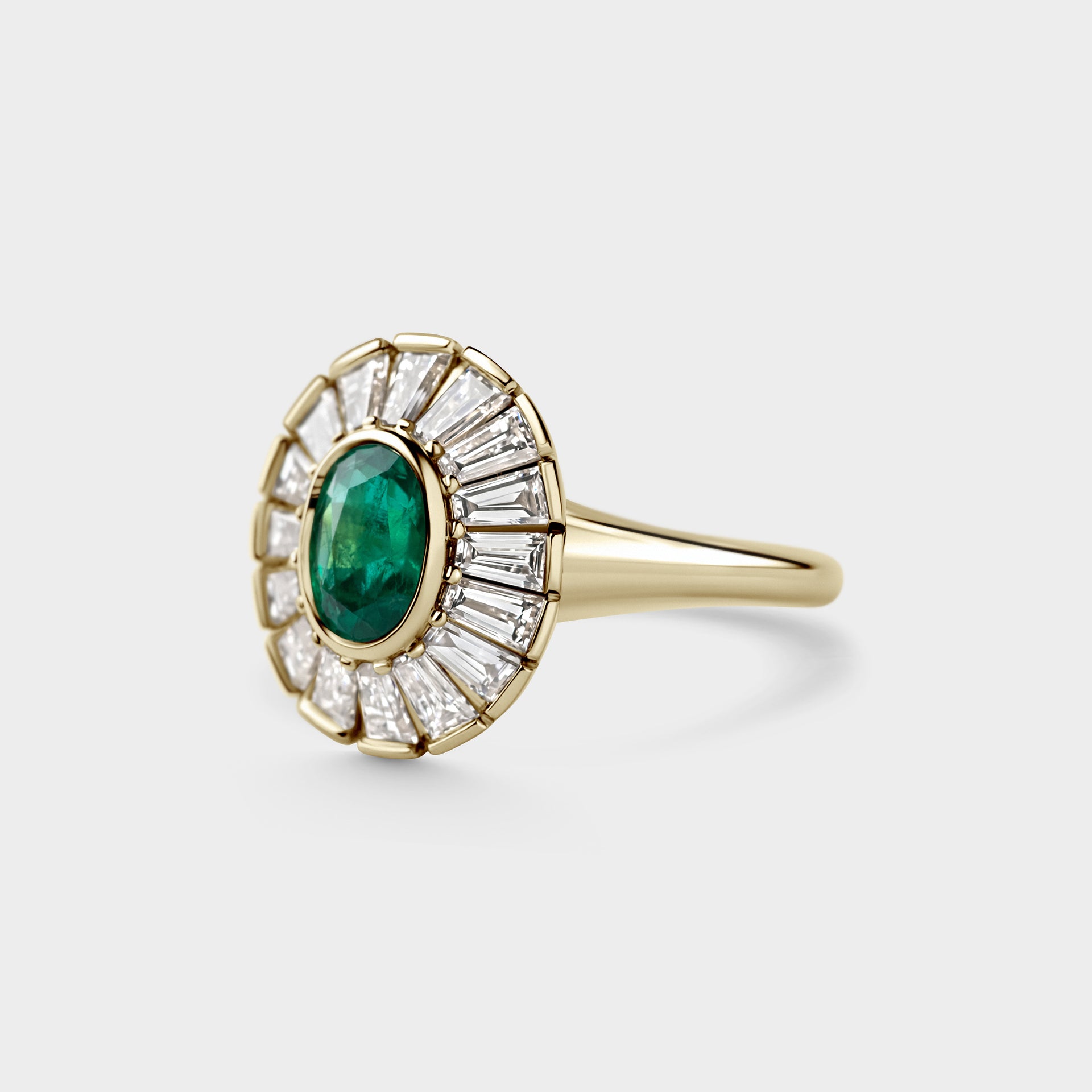 0.71ctct Oval Emerald & Tapered White Diamond Baguettes