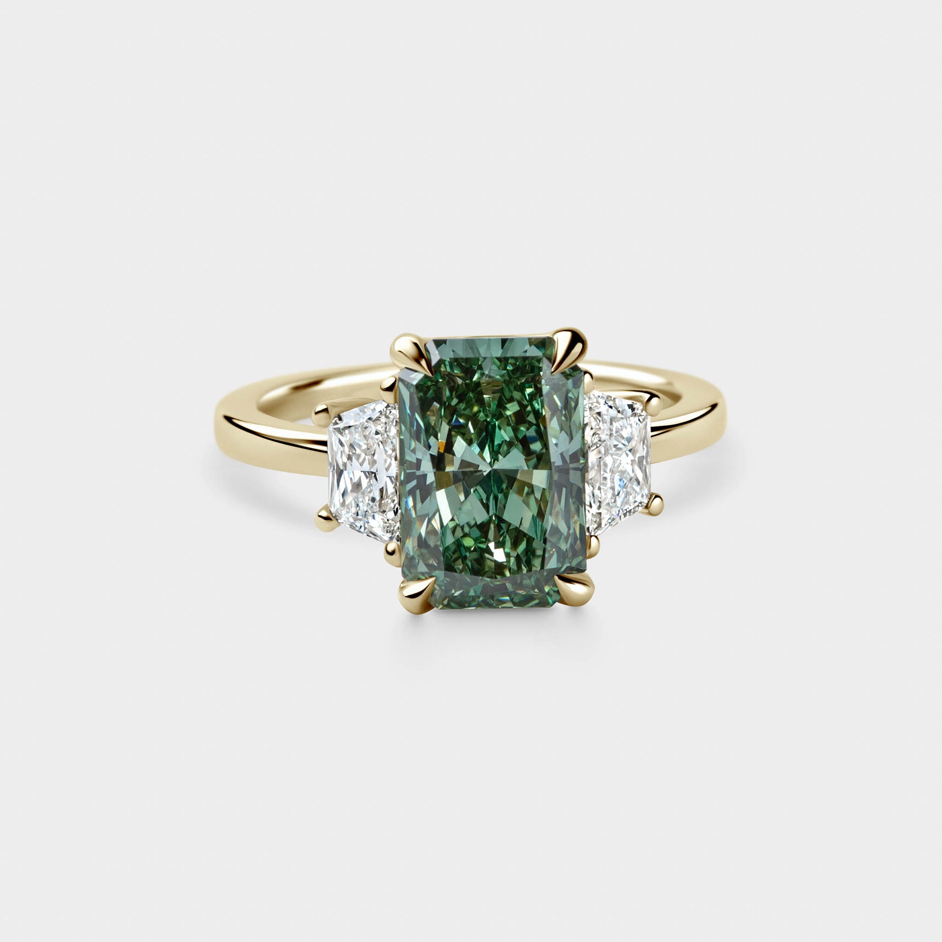 3.28ct Three Stone of Green Radiant & Trapezoid