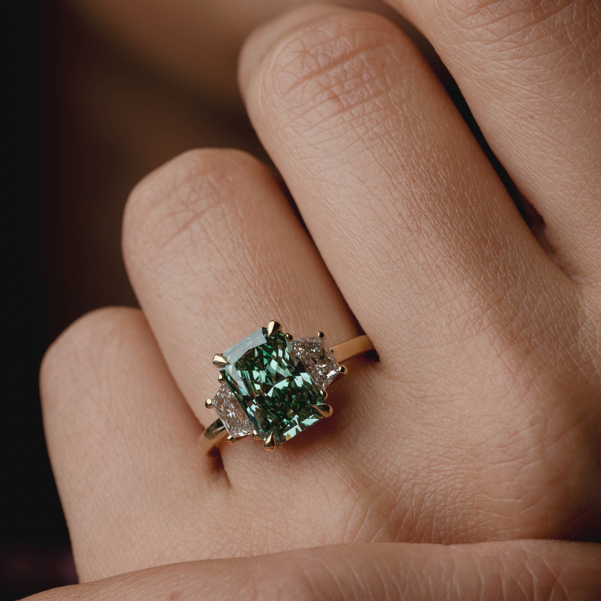 3.28ct Three Stone of Green Radiant & Trapezoid