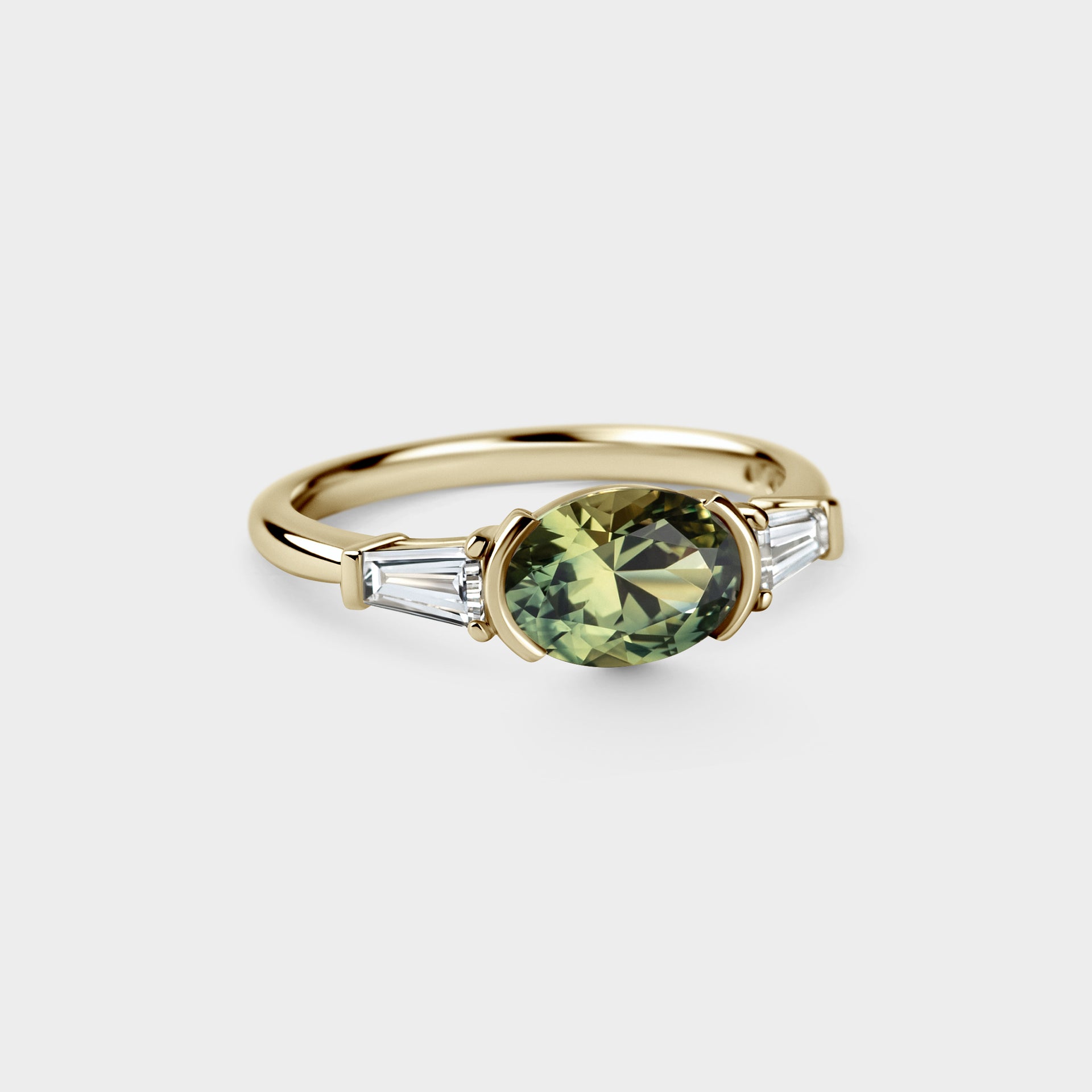 1.54ct East-West, Three Stone of Oval Sapphire & Tapered Baguettes