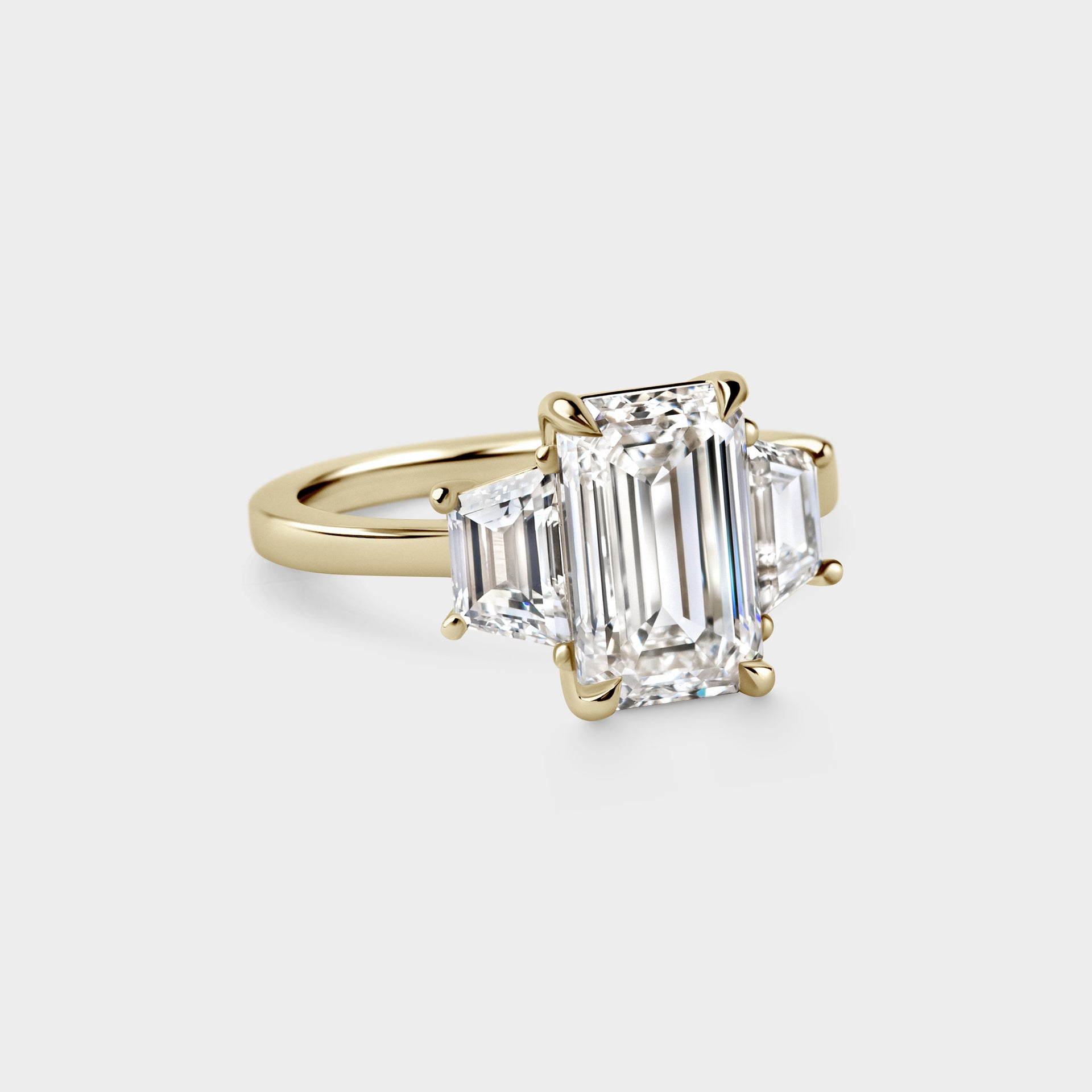 3.08ct Three Stone of Emerald & Trapezoid